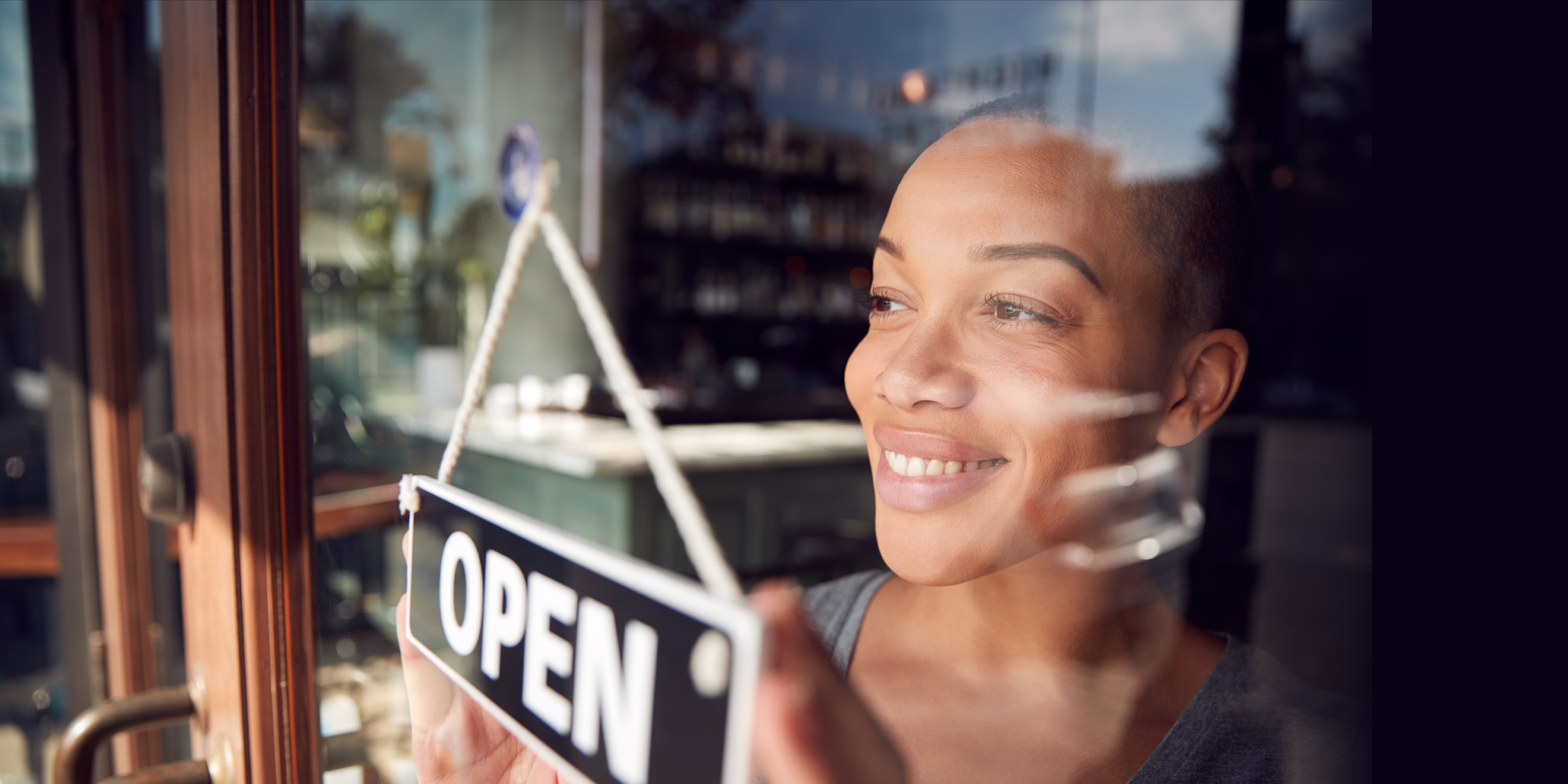Woman with open sign