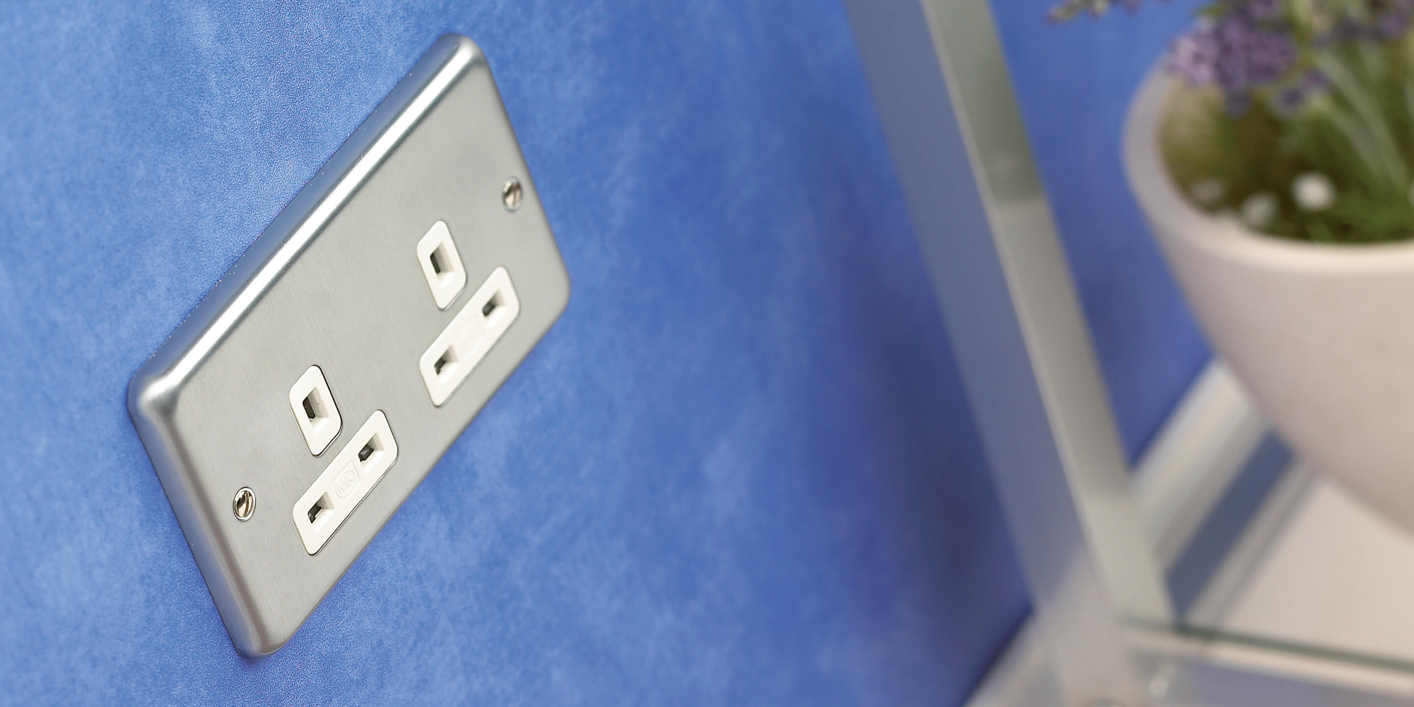 Albany plus product on blue wall 