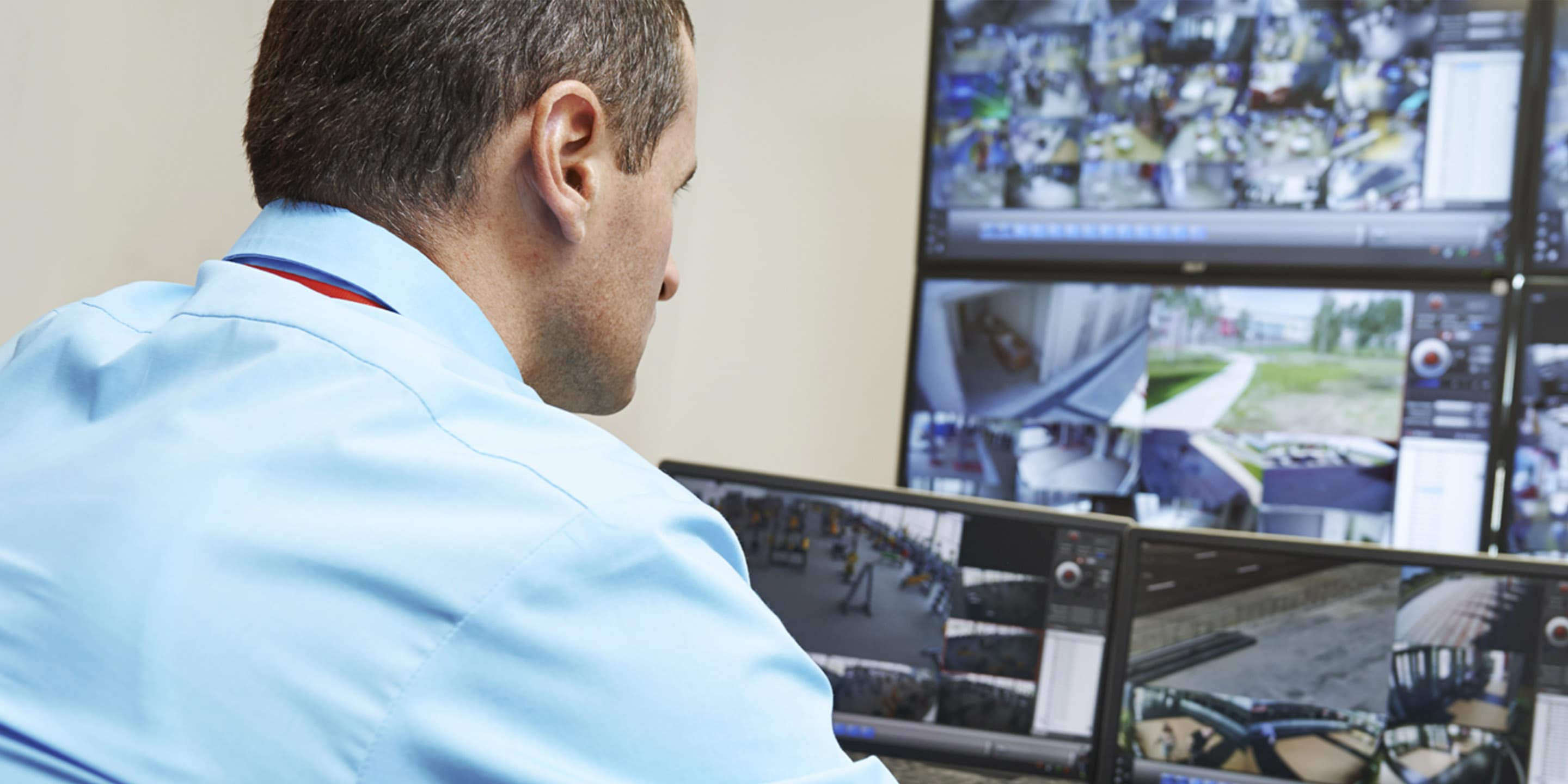 Security person monitoring security footage
