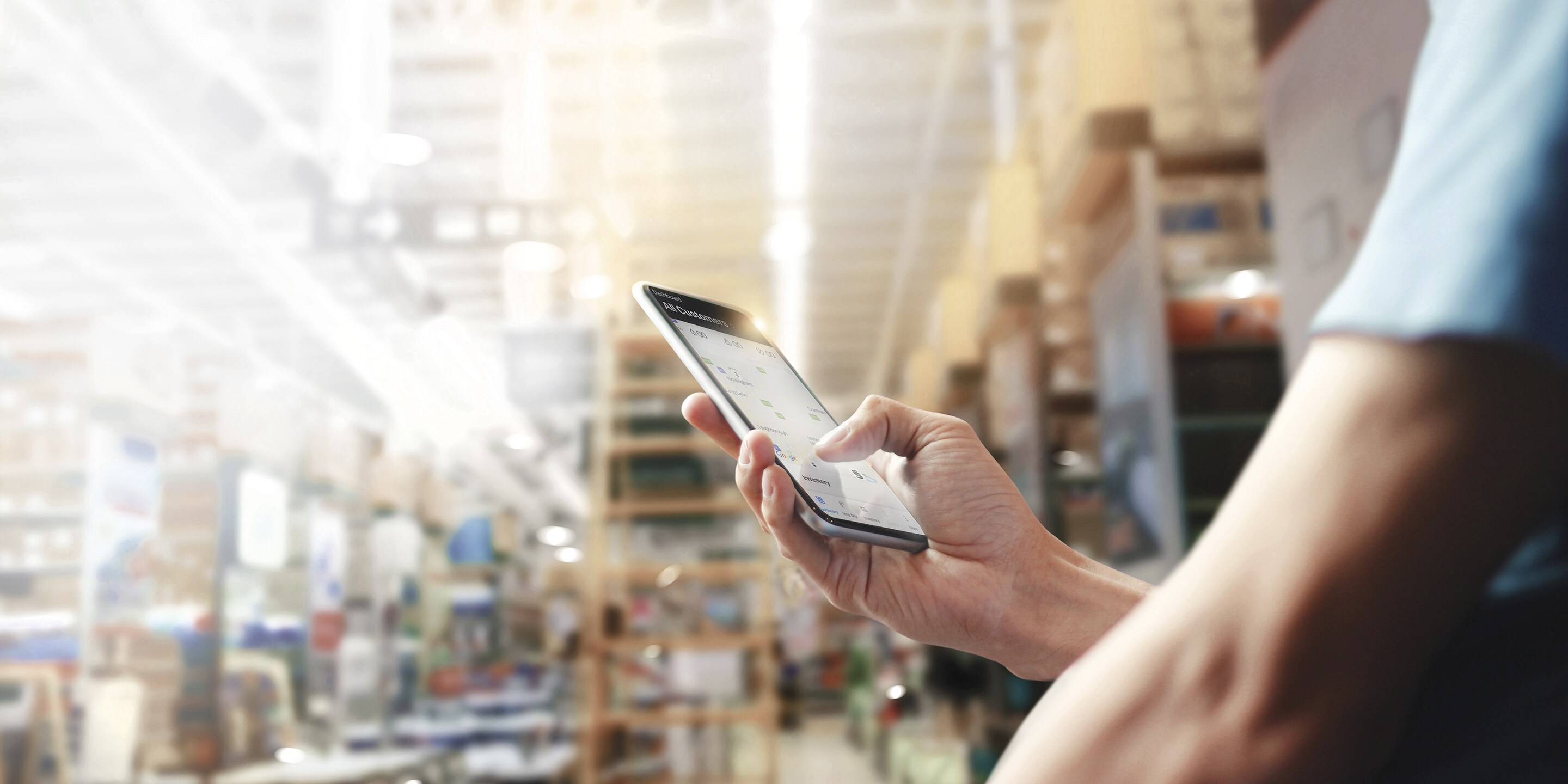 Factory worker holding mobile phone