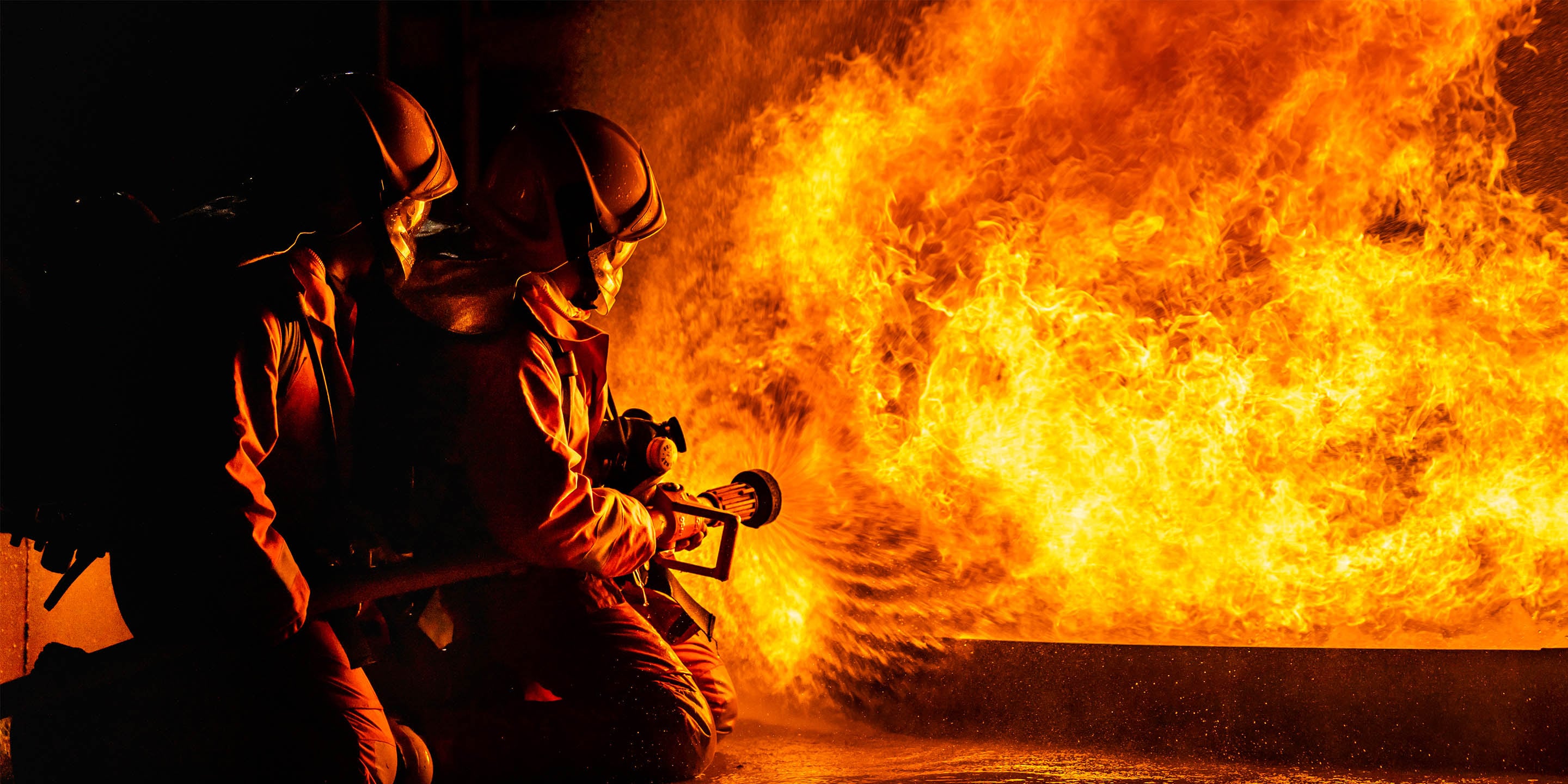 Firefighters extinguishing fire 