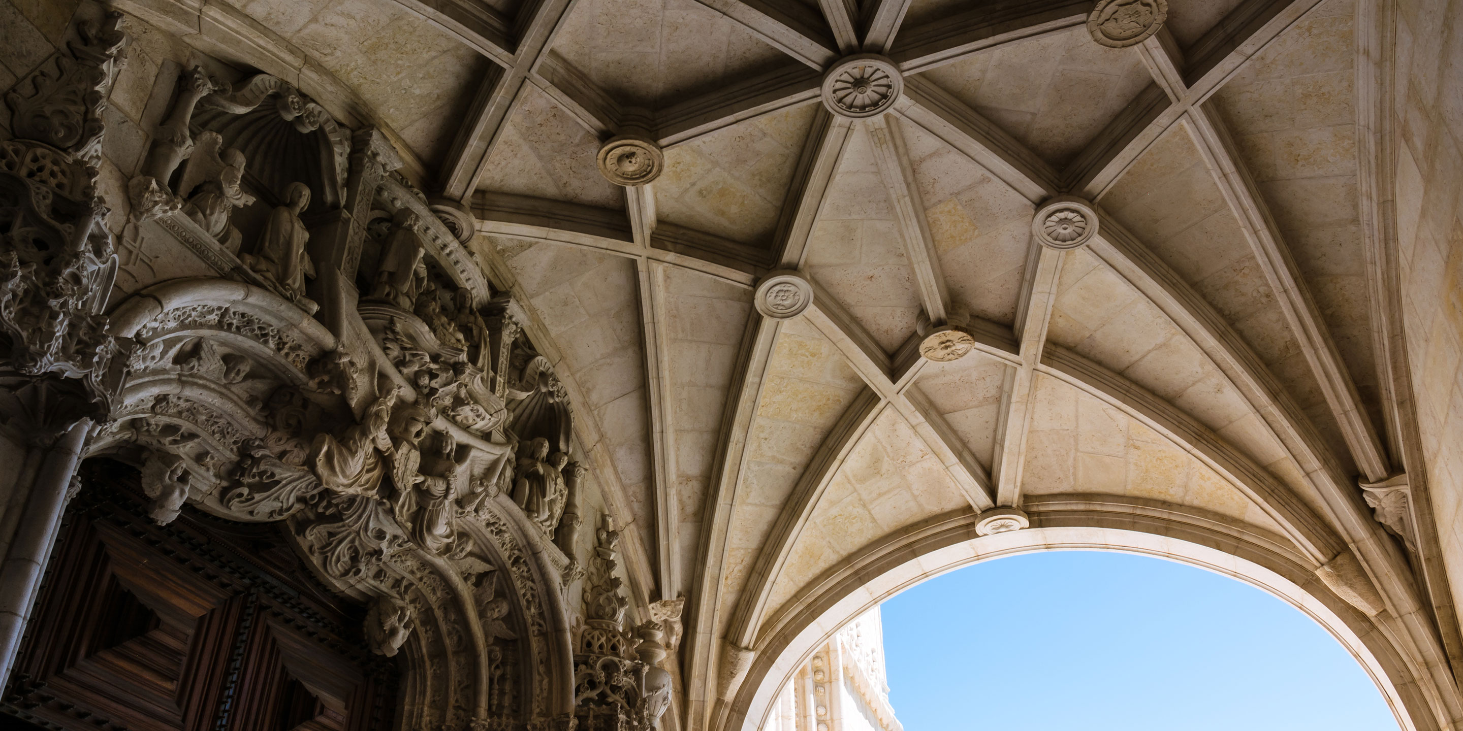 Intricate carvings and arches under a beautifully vaulted ceiling.