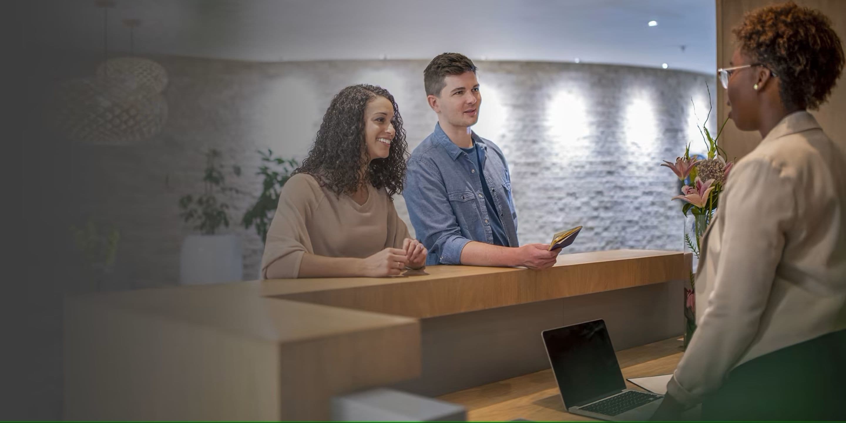Onity couple checking in to hotel