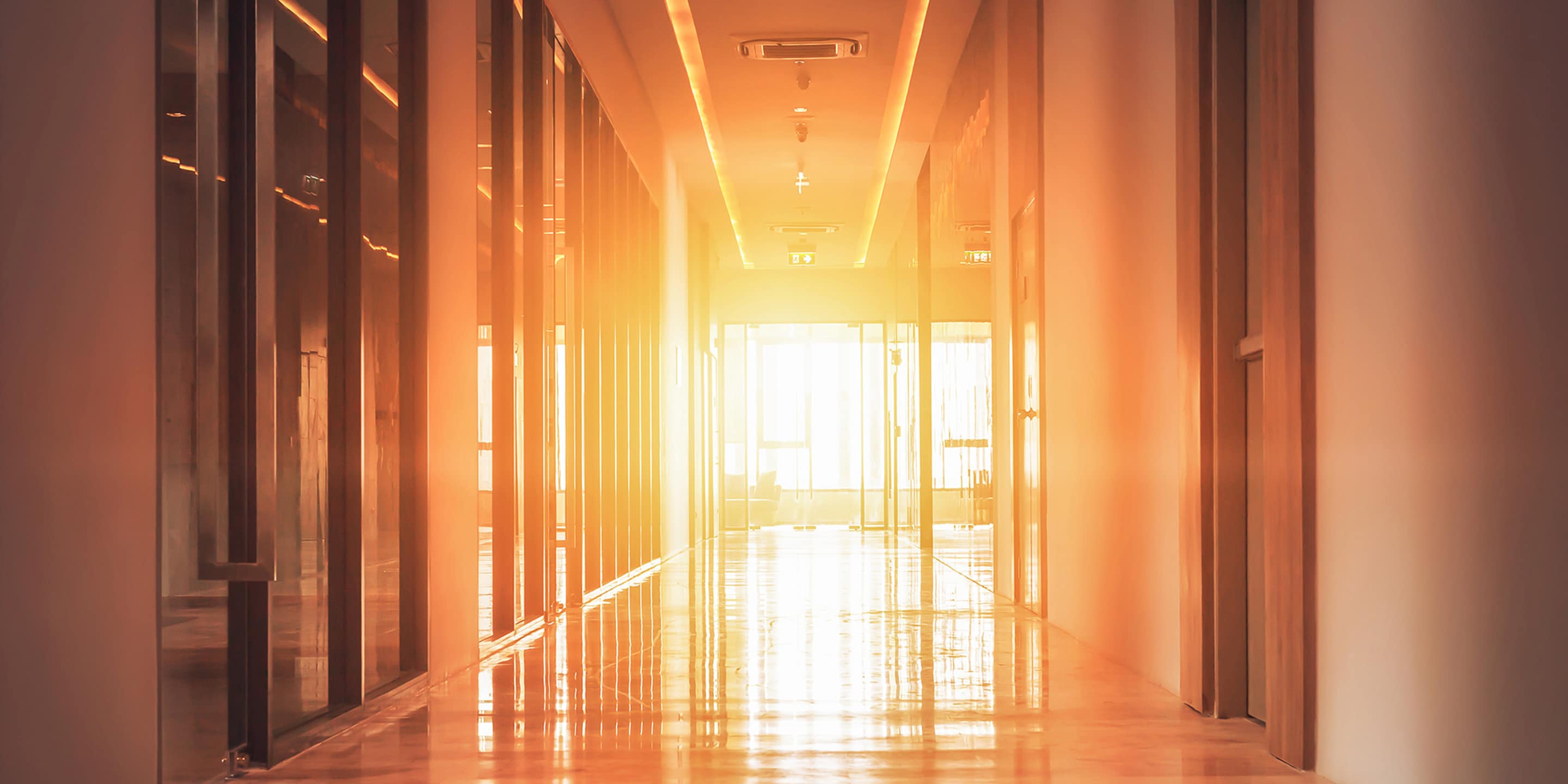 Warmly lit hotel hallway