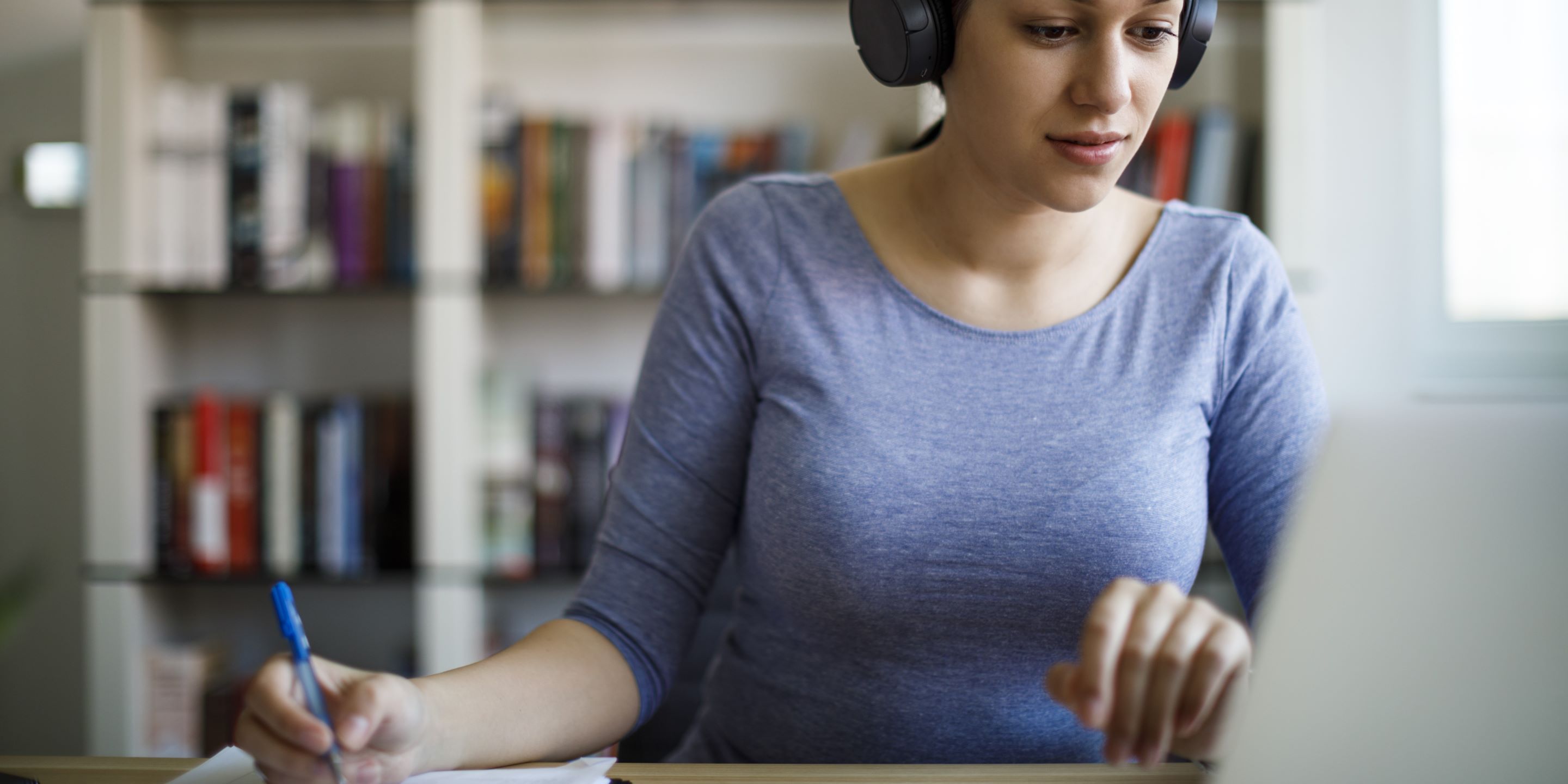 Young female working at home office
