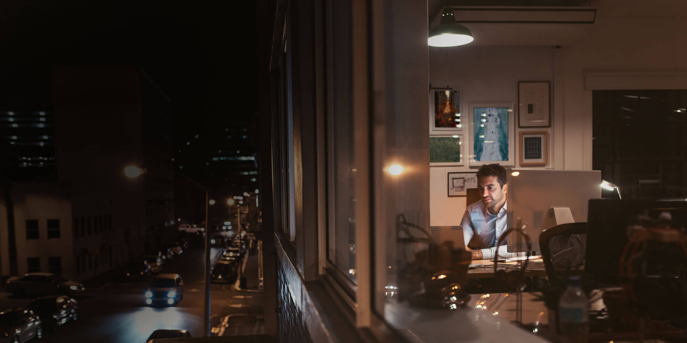 Person sitting inside apartment.