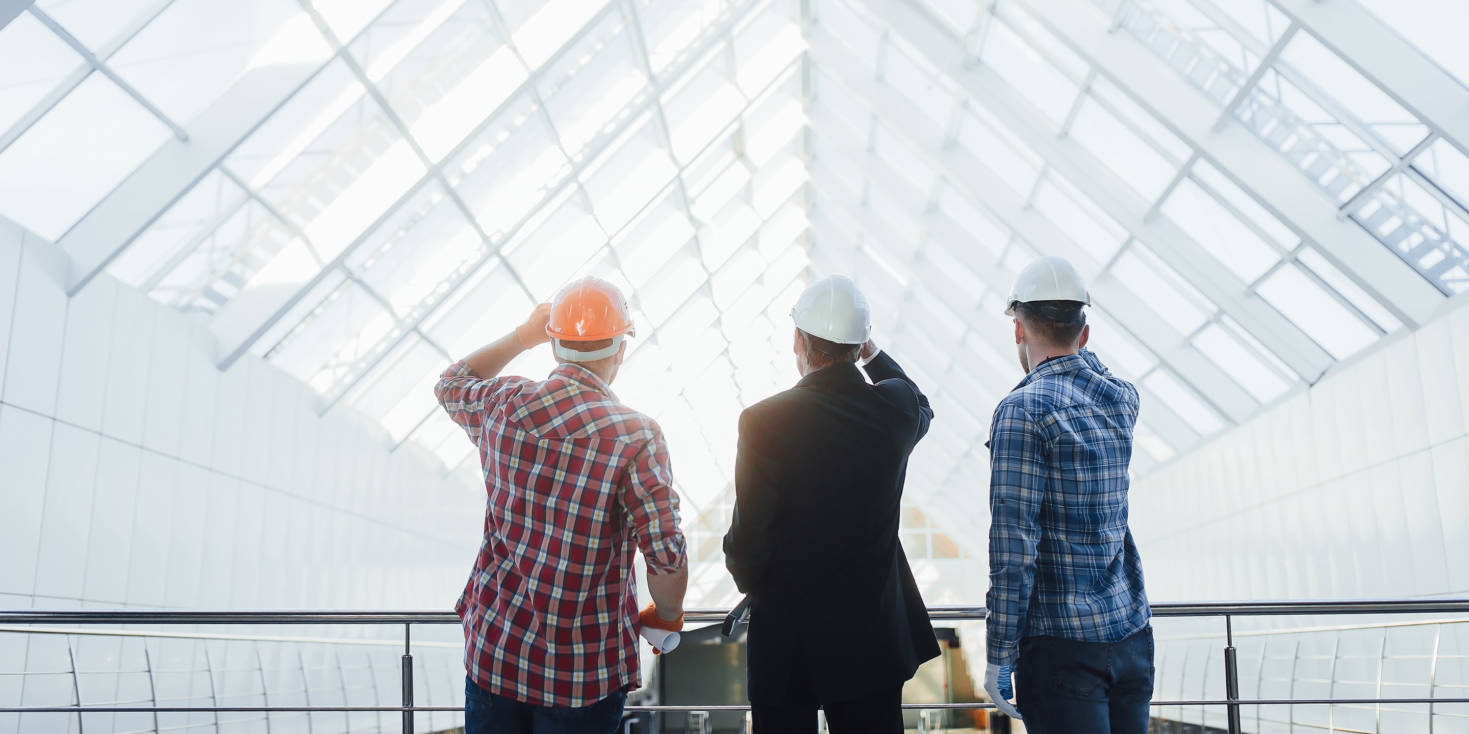three inspectors in hard hats