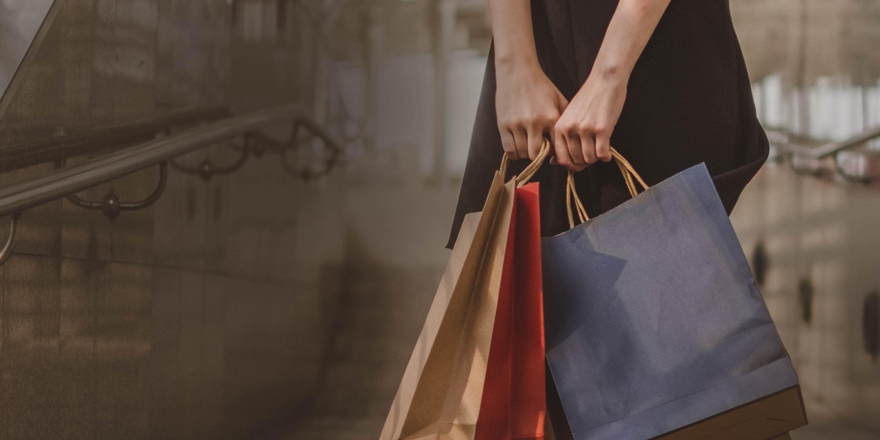 Woman holding two shopping bags